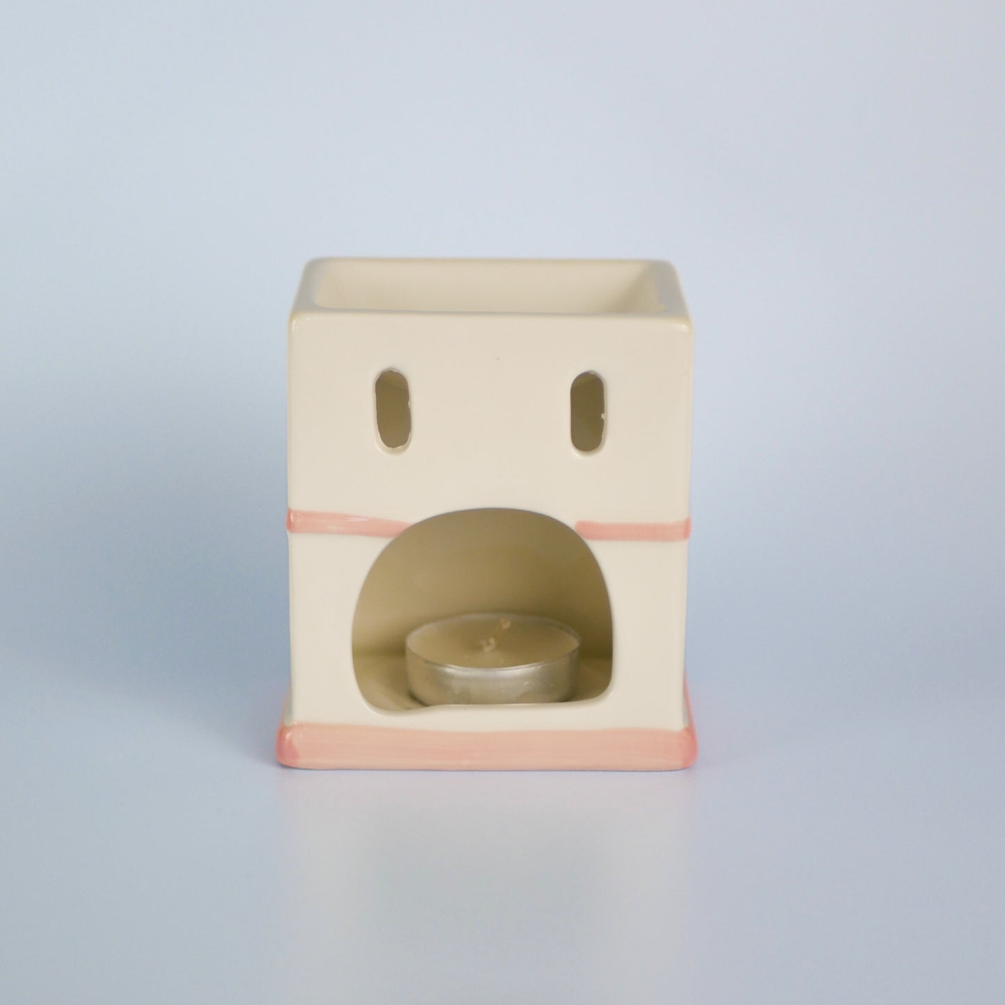 A pastel townhouse wax melt burner