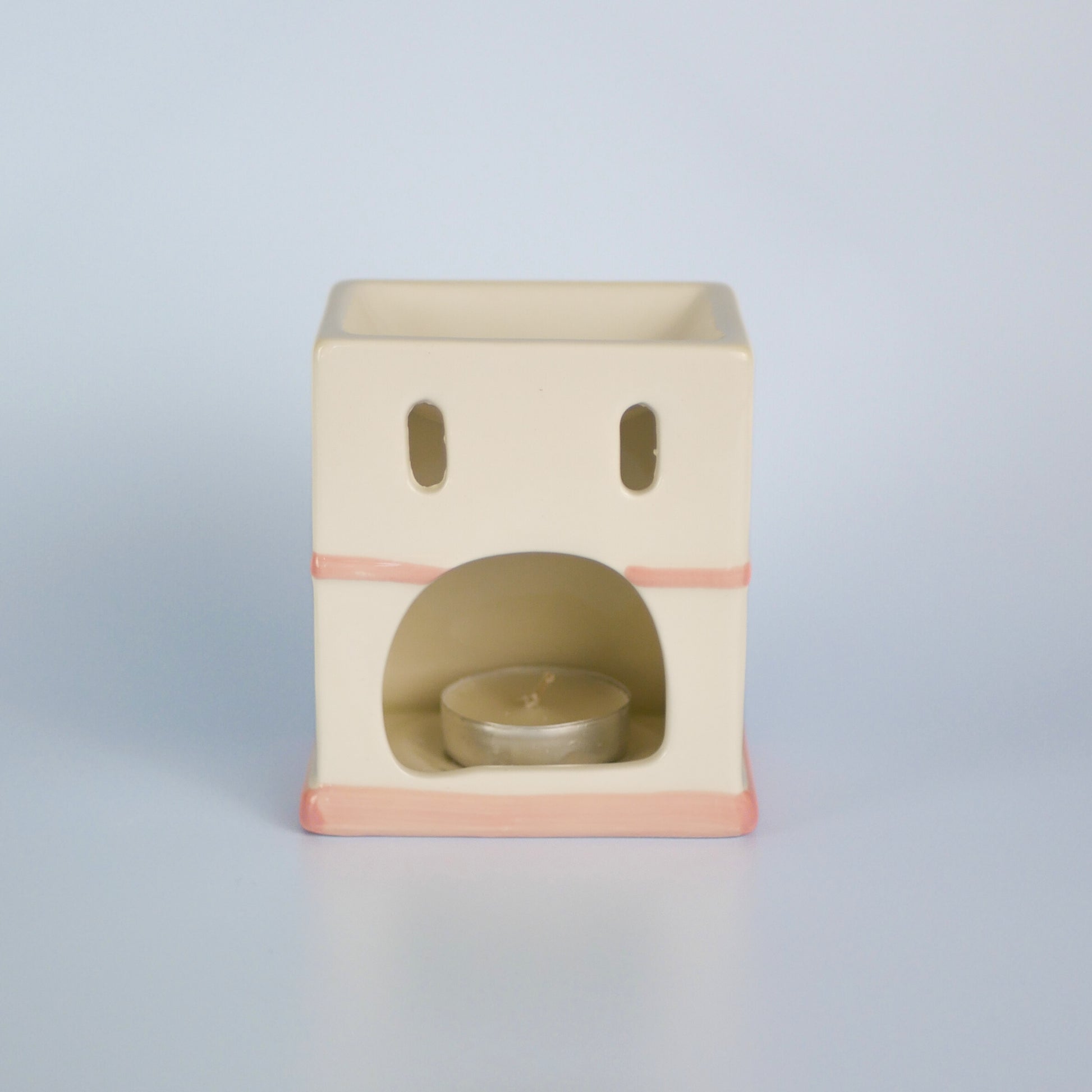 A pastel townhouse wax melt burner