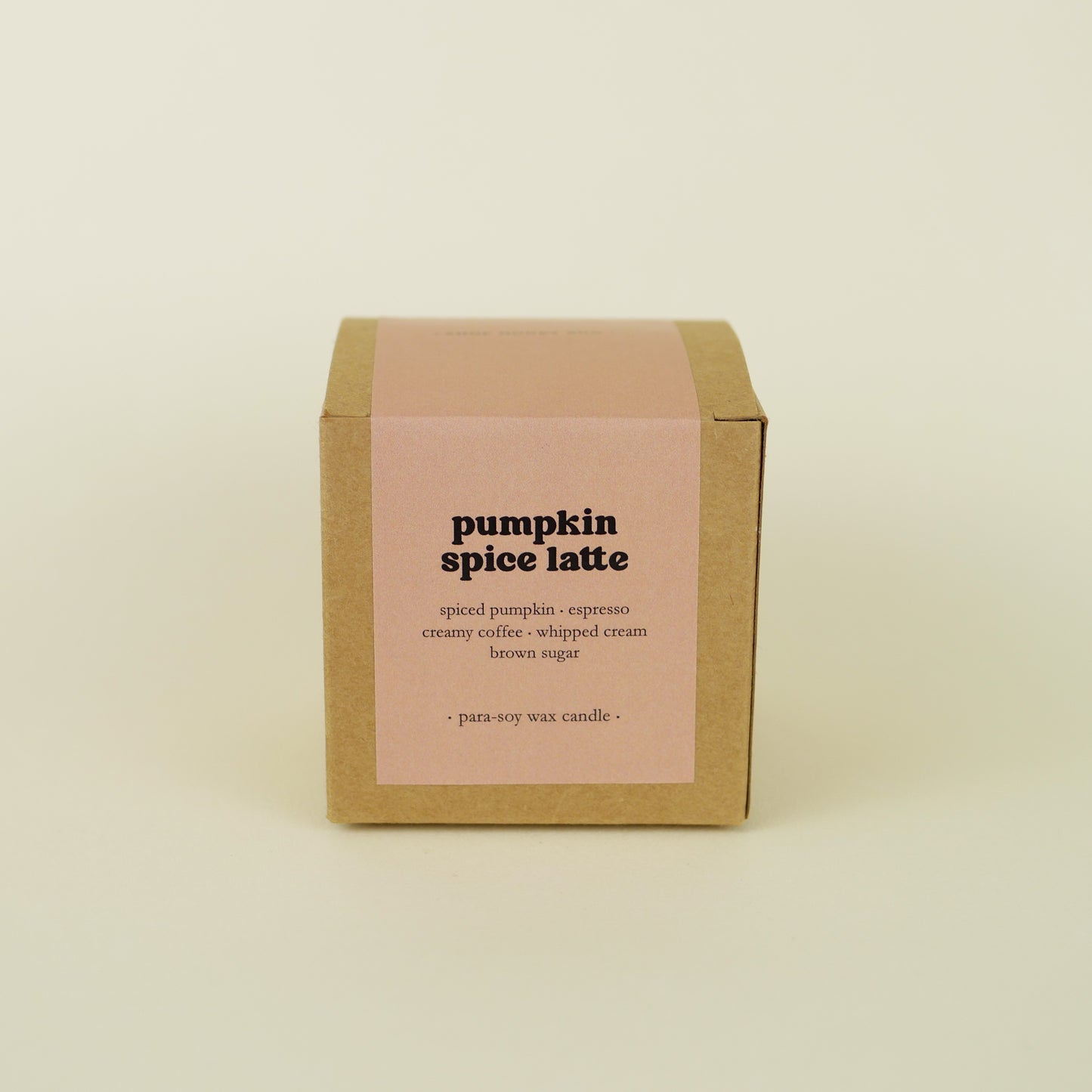 A 20 hour burn time pumpkin spice latte scented tin candle in a brown kraft box with a pale brown paper label